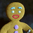 Pixelated gingerbread man icon with red lips and blue eyes on dark background, surrounded by red text blocks reading 'gingerbread man..... great holiday', 'treat or childhood segway to cannibalism?', 'you be the judge!'