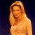 A pixelated contact sheet showing two frames of an animated icon featuring a woman with long blonde hair on the left and green text reading "Original Icons .com" on the right against a dark background.