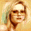 Animated sequence showing a person with blonde hair and glasses in three distinct poses against an orange background, accompanied by repeated text elements.