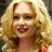 A 48x48 pixel animated contact sheet showing two frames: a blonde woman with curly hair and red lipstick on the left, and a red mailbox with "ARRESTED DEVELOPMENT" text above it on the right.