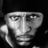 Black-and-white portrait of a person with a headband on left, purple background with yellow pixelated text reading "Respect Is Due To Everybody But I Dont I Take It Ask For My -Ray Lewis Respect".
