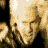 Animated sequence of a figure with light-colored hair and dark clothing, showing head movements from forward to side views against black background.
