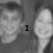 Black-and-white pixelated image of two people with text "I LOVE MEGAN" overlaid, showing a static composition.