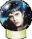 Two side-by-side pixelated images of a person with dark hair under a blue-tinted glass dome on a yellow base, showing slight facial expression differences.