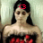 Pixelated image of a woman with long black hair wearing a red and black dress, red text on forehead.
