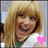 Two side-by-side pixelated images of a person with blonde hair, each featuring a heart symbol below the face.