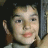 A child with dark hair and light skin appears in four showing eye closures, mouth movements, and head position shifts against a textured background