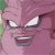 Pixelated close-up of a pink-skinned character with narrowed eyes and a wide, toothy grin, set against a blurred background.