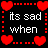 Pixelated heart border frames text about sadness and loss on a black background with red and pink hearts.