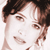 Static pixelated close-up of a person's face with brown hair and light skin tone, rendered in low-resolution 256x256 pixels.