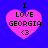 Four identical pixelated pink hearts on a blue background, each containing black text reading "I LOVE GEORGIA <3" with the heart shape having slight variations in outline and fill across frames.