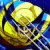 Pixelated yellow and blue cartoon skull with wide eyes and a toothy grin, set against a dark blue background.