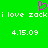 Green background with pink heart symbol above white pixelated text reading "i love zacki love zack" and "4.15.09" repeated twice.