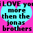 A static image with a bright pink background featuring two identical cyan hearts containing black text that reads "i LOVE you more then the jonas brothers".