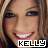 Static pixelated image of a smiling person with visible teeth and brown hair, featuring the text "KELLY" in blocky white letters at the bottom.