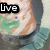 A pixelated image of a person with green and orange hair wearing a teal shirt, with text changing across frames.