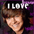 Pixelated image of a smiling person with brown hair, purple background, and white text reading "I LOVE" above and "ZAC EFRON" below.