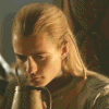 A person with long blonde hair drinks from a dark brown mug in a sequence of showing gradual head movement and mug position changes