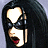 A 48x48 pixel animated buddy icon featuring a cartoon woman with long black hair and red lips on the left, next to green text reading "Original Icons .com" on a dark green background.