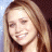 A 48x48 pixel buddy icon featuring a side-profile of a person with long light brown hair on the left and green text reading "Original Icons .com" on a dark green background on the right, displayed as part of an animated contact sheet.