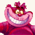 Pixelated pink character with wide grin, large eyes, and spiky hair, wearing a red garment against a plain background.