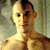 A pixelated buddy icon featuring a shirtless man on the left and green text reading "Original Icons .com" on the right against a dark background.