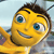 Yellow cartoon bee with blue eyes, brown hair, and antennae, smiling with visible teeth against a light blue background.