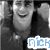 Black-and-white photo of a smiling person in dark clothing with hands raised near head, overlaid by blue pixelated text.
