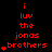 Red pixel text on black background reads 'i luv the jonas brothers' with heart symbols, animated to change heart count per frame.