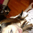 Pixelated image of a person with brown hair and light skin, wearing dark clothing, with green text reading BITCH overlaid on the right side.