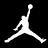 White pixelated silhouette of a basketball player mid-air with one arm extended upward holding a ball, legs spread wide apart against black background.