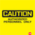 Yellow background with black-bordered yellow text reading 'CAUTION' in pixelated font, below which is blurred pixelated text, and a small red pixelated shape in the bottom right corner.