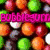 Pixelated candy-themed buddy icon with text labels for different flavors, featuring a of colorful round candies in orange, green, purple, and white
