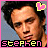 A 48x48 pixel animated contact sheet showing two frames of a buddy icon with a person's face, pink border, yellow and pink text, and a heart symbol that changes shape between frames.