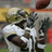 Pixelated football player in white uniform holding a ball, with yellow text on black background listing player details.