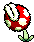 Pixelated red and white mushroom with green stem in two states: closed bud and open mouthed form.