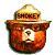 A pixelated cartoon bear mascot wearing a ranger hat with visible text on the band, next to green stylized text reading "Original Icons .com" on a dark background.