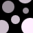 Black background with scattered gray and white circles of varying sizes, some partially cropped at edges.