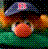 Pixelated character with dark hair, wearing a blue cap and orange shirt against green background.