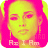 Pixelated portrait of a person with yellow-green skin tones and bright pink hair, wearing a pink top, with text reading 'Re I Am' at the bottom.
