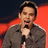 A pixelated image shows a person holding a microphone against a red and dark background, with red text reading "DAVID ARCHULETA" and a heart symbol on the right.