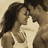 A pixelated image of a couple kissing, with text overlays on an orange background.