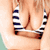 A woman with long blonde hair wears a blue and white striped bikini top against a light green background, shown in four sequential poses.