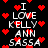 Black background with white text reading "I LOVE KELLY ANN SASSA" surrounded by red pixelated hearts, some of which flicker or change position.