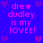 Blue background with pink text and purple hearts, displaying 'drew dudley is my LOVEE!' in four identical sections arranged in a pattern