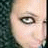 A split-screen view of a person's face with one eye visible on the left and both eyes closed in a wink gesture on the right.