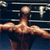 Static pixelated image of a boxer in mid-punch pose with blurred background elements suggesting a boxing ring.