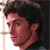 A pixelated image of a person with dark curly hair in three showing slight head movement, text reading "Jess" and a heart symbol