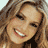 Static 48x48 pixel icon showing a close-up of a smiling person with light brown hair and visible teeth, rendered in low-resolution pixel art style with warm tones.