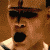 six identical pixelated faces with dark sunglasses, open mouths showing black voids, and light-colored collars against a brown background